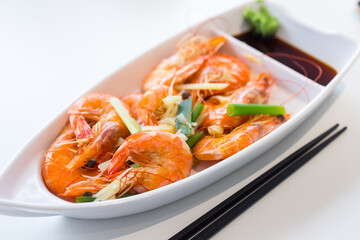 Wall Mural - Steamed shrimp with green onion and garlic on the dish