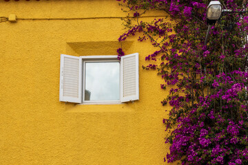 Ferragudo, Portugal. 04-20-2024.   Colorfull house with flowers at Ferragudo, Algarve, Portugal.