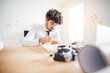 © Halfpoint - Businessman having quick lunch, fastfood meal in startup company office. Working in co-working space.