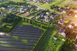 © AlexGo - Sustainable Residential Area with Solar Panels Plant Aerial View