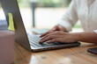 © crizzystudio - Beautiful asian businesswoman Confident working with a laptop, typing, small business owner online freelance worker ecommerce marketing concept, finance, real estate agent.