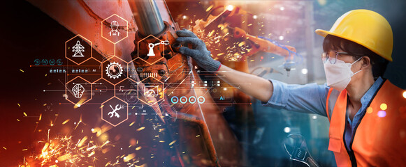 Fototapete - Engineer analyzing, repairs and maintains robot arms in hard industrial plants  with monitoring system software. Intelligent factory, Digital manufacturing operation. Industry 4.0