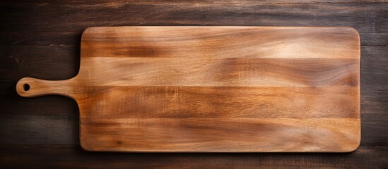 Poster - A top down view of a rectangular vintage style cutting board with a handle and a wooden spoon The image features empty space for copy or other elements