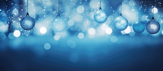 Poster - A copy space image of abstract blue and silver glittering bulbs lights in a blurry Christmas wallpaper portraying the concept of holiday festivities with sparkle and lit celebrations