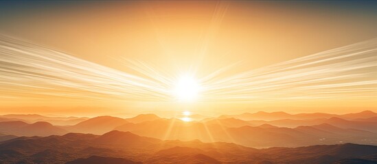 Poster - A stunning landscape of mountains with a vibrant sunset and sun rays creating a special circular area for text The image includes a blurred effect for copy space