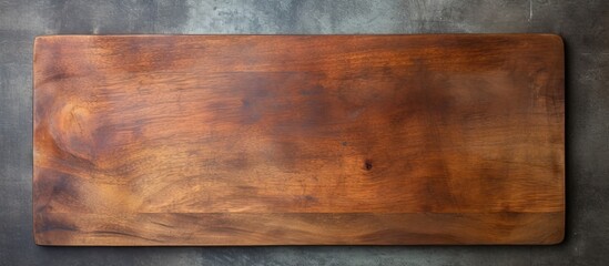 Poster - A top down view of a rectangular vintage style cutting board with a handle and a wooden spoon The image features empty space for copy or other elements