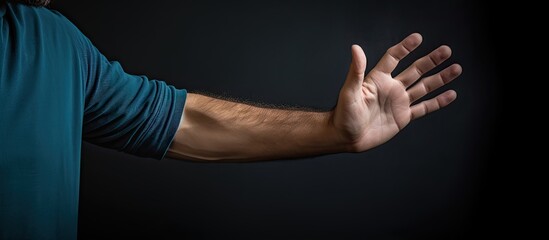 Sticker - A man wearing a blue shirt gestures with both hands to indicate a specific direction The focus is on the man s hand and index finger creating a panoramic image with ample copy space