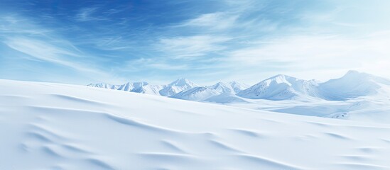 Poster - A stunning winter backdrop showcasing a snow covered ground with a natural snow texture adorned with wind formed patterns on the snow surface Perfect for creative projects with copy space image