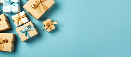 Leinwandbilder - Convenient shopping made simple with sales and discounts A flat lay perspective from a high angle showcases a group of beautifully wrapped gift boxes tied with ribbons set against a blue background A