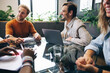 © Jacob Lund - Group of male and female business professionals meeting in a boardroom