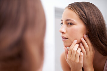 Wall Mural - Face, beauty and inspection with woman in bathroom of home for skincare, cosmetics or mirror. Aesthetic, wellness and skin pimple with confident young person in apartment closeup for dermatology