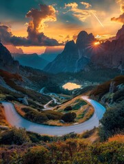 An empty winding road high in the Italian Alps, a lake in a gorge, sky illuminated by the sun's rays at sunset, incredible nature, bright saturated colors