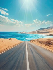 Canvas Print - Empty highway, huge desert sand dunes on one side of the road and sea coast on the other, blue water, clear sunny day, bright rays, incredible nature