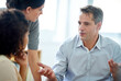 © ArcursPI/peopleimages.com - Mentor, people and feedback in collaboration for project, coworking in office or company as team. Group, diversity and listening in corporate, digital agency for deadline or development as colleagues