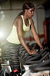 © MollerFinest/peopleimages.com - Cycling, gym or black woman on bike machine for cardio training, workout or energy for endurance. Development, exercise or healthy African sports person in club for fitness, challenge or wellness