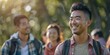 © Nene - Asian Man Participating in a Herbal Hike with a Group of People, Exploring Nature and Learning About Plants