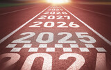 Start of new year. Changes of year 2025, 2026, 2027 on Running track. Concept of new ideas starting in new year, planning along with setting objectives to set KPI goals for success in life.