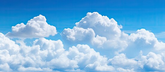 Poster - White cumulonimbus clouds in the blue sky. Creative banner. Copyspace image