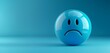 © filmanana - Sad blue emoticon sphere on gradient background expressing emotions and feelings