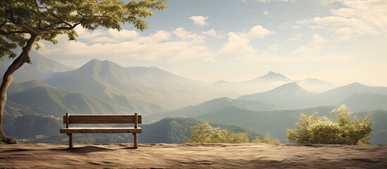 Wall Mural - a bench with a table under a tree against the background of mountains. creative banner. copyspace im