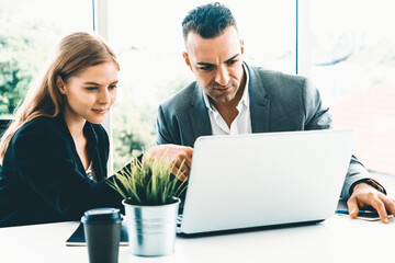 Wall Mural - Businessman executive is in meeting discussion with a businesswoman worker in modern workplace office. People corporate business team concept. uds