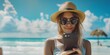 © Iryna - A stylish traveler on vacation at the beach snaps a photo with her smartphone, enjoying the sunny day