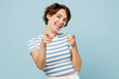 © ViDi Studio - Young smiling woman wears striped t-shirt casual clothes point index finger camera on you motivating encourage isolated on plain pastel light blue cyan background studio portrait. Lifestyle concept.