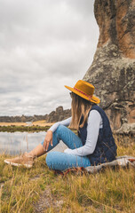 Wall Mural - A woman traveling through the peruvian andest. Huayllay Stone Forest, Peru.