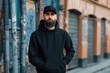 © Isuru - Urban hipster man in black hoodie and hat mockup.