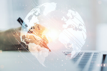 Wall Mural - multi exposure of abstract graphic world map and hand writing in notepad on background with laptop, 