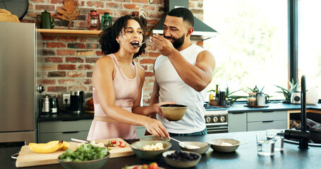 Poster - Happy couple, wellness and tasting in apartment for nutrition, together with spoon for healthy diet. Man, woman and breakfast with fruit in house for morning date, excited for cooking in kitchen