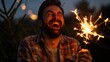 © Artyom - Caucasian male joyfully holding sparkler outdoors at night, laughing heartily