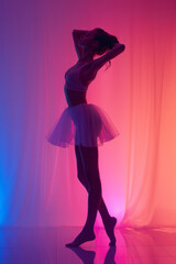 Aufkleber - Silhouette of a female figure stretching on a gradient pink and purple background,