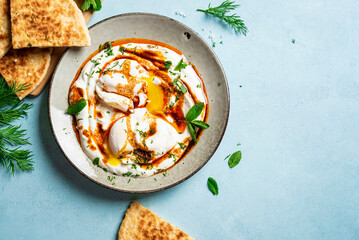 Poster - Turkish eggs Cilbir and fresh pita bread