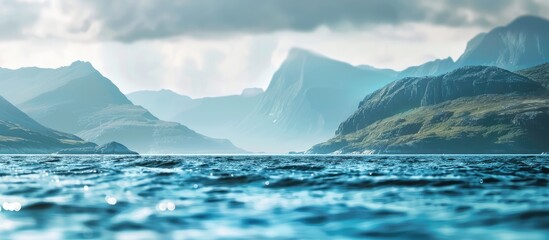 Wall Mural - Scenic view of the sea and mountains with blurred background and room for text