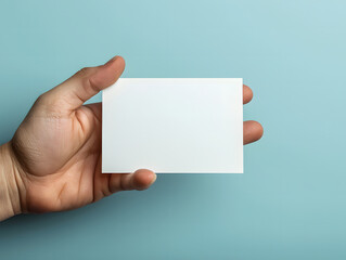 Hand-holding blank business card mockup
