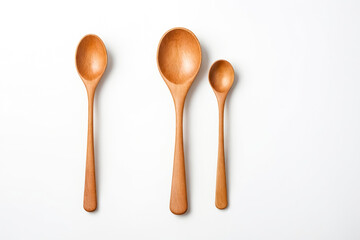 Wall Mural - Three Wooden Spoons on White Background