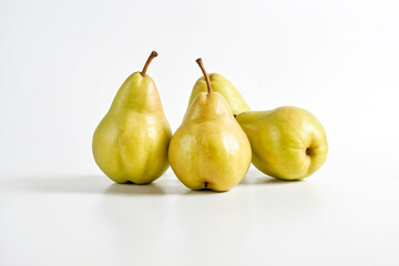 Wall Mural - Four Yellow Pears on a White Background
