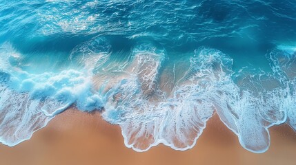 Canvas Print - Aerial view of the sea breaking on a sandy beach