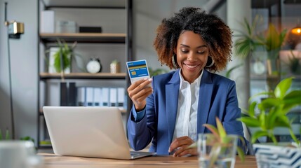 Poster - Young professional woman holding credit card in modern office. Business and finance concept. This image shows a stylish office setting with a professional working. AI