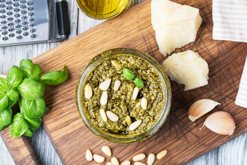 Poster - Bowl of basil pesto on wooden table