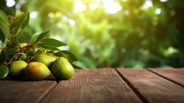 Fresh green pears on wooden table with lush foliage background or a bunch of avocados sitting on a light brown wooden table with blurring background. Natural food and healthy diet concept. AIG35.
