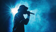 © The Stock Photo Girl - Silhouette of rap singer performing on stage. Bright blue background with hip hop artist performing on concert in night club