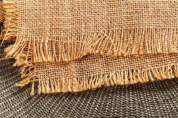 Wall Mural - Close-up shot of burlap fabric with frayed edges, showcasing the texture and weave