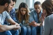 © Oleksandr - Engaged participants in a therapy group session promoting mutual support