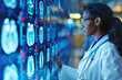 © SnapVault - An African American female radiologist in a white coat analyzes brain scans on a large digital screen in a dimly lit medical center.