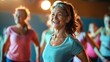 © Sparrowski - Smiling Women in Their 40s and 50s Enjoying Energetic Group Fitness Class Together, Exercising with Enthusiasm and Team Spirit in a Positive Gym Environment, Promoting Health and Well-Being