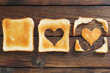 Wall Mural - Toasted bread with a heart-shaped cutout