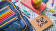 © Alexandra - Blue school backpack full of colorful stationery lying on a table with a notebook saying back to school