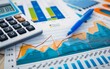 © Mark - Financial charts showing trends, a calculator, and a blue pen. Perfect for money and financial stock photos.